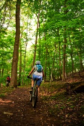 riding a bike, the beautiful light shining through the tree leaves and the morning fog on a challenging woodland trail near Pittsburgh in Western Pennsylvania on a spring day of May 25th, 2021., a Sports & Recreation Photo by Karina Eremina