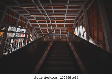 Riding the escalator, the metro building's glass exterior catches the light. Below, the city pulses with energy—busy streets, people, and cars, while the skyline stretches into the distance. - Powered by Shutterstock