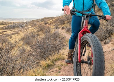 Riding Fat Mountain Bike On A Single Track Trail In Northern Colorado Grassland, Early Spring Scenery In Soapstone Prairie Natural Area Near Fort Collins