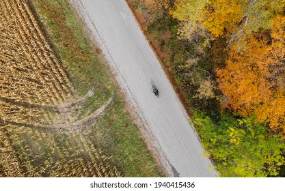 Riding Motorcycle Down A Back-country Road In The Fall (drone)