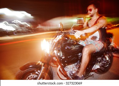 Riding Motorcycle On Night Streets Without Helmet . Long Exposure. High Speed Driving.