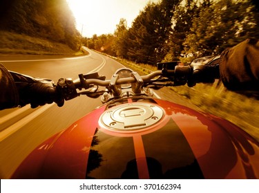 Riding Motorcycle In The Sunset.