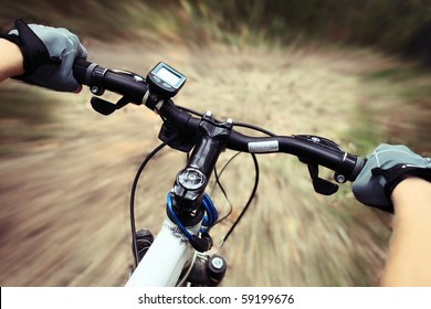 Riding on a bike on forest's path - Powered by Shutterstock