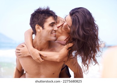 Riding on romance. a young couple enjoying a beach getaway. - Shutterstock ID 2275680825