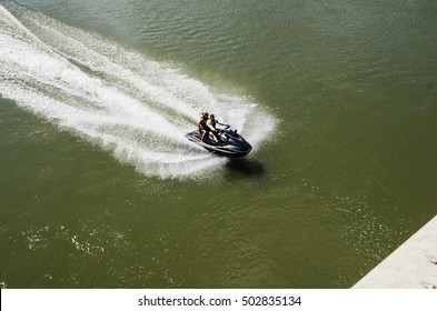 Riding On A Water Scooter. View From Above