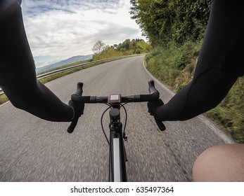 Riding A Racing Bicycle POV. Personal Perspective Of A Young Adult Cyclist Training On A Racing Bike