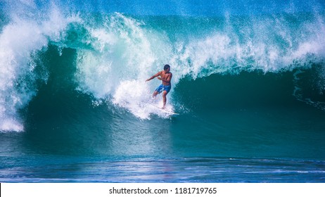 Riding the waves. Costa Rica, surfing paradise. Carlos Munoz, world-class professional surfer