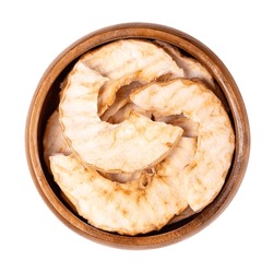 Riffled Apple Chips, A Healthy Snack, In A Wooden Bowl. Dehydrated, Wavy Cut Apple Slices, Sweet Chips Or Crisps With A Dense And Crispy Texture. Close-up, From Above, Isolated Over White, Food Photo.