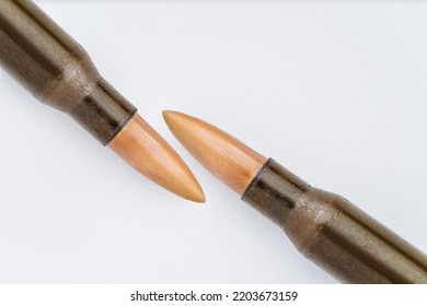 Rifle Bullet Long Cartridge On White Background. Army Or Hunting Weapon Shot Object, Violence And Danger Symbol.