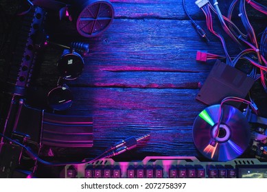 Rifle, computer keyboard, compact disk and glasses on the flatlay background with copy space.
