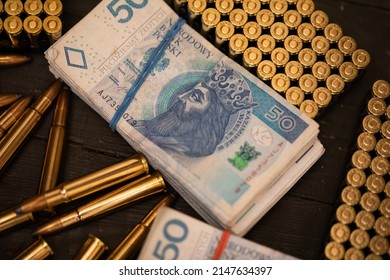 Rifle And Pistol Cartridges Lie Along With Paper Bills.