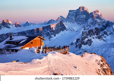 Rifugio Lagazuoi and Cable car station against the background of the Dolomites at sunset. Winter Alps near Cortina d'Ampezzo, Veneto, Italy. Postcard, Falzarego Pass, Dolomiti. Famous observation deck