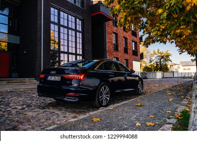 Riga, Latvia 14 November 2018, Audi A6 S line C8 Fifth generation 2019 autumn leaves  background 