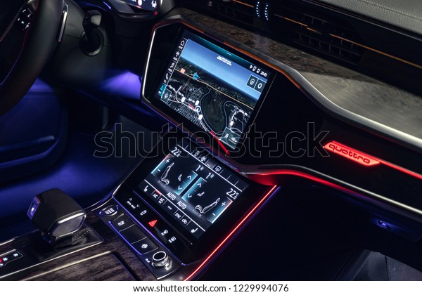 Riga, Latvia 14 November 2018, Audi A6 S line C8\
Fifth generation interior dashboard navigation and wheel at night\
ambient light