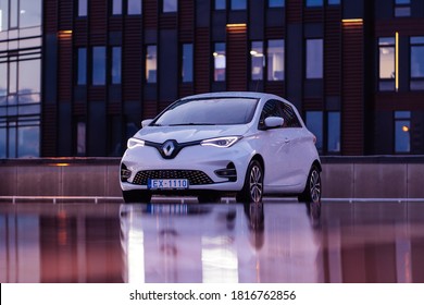 Riga Latvia 17 September 2020 Renault Zoe Is A Five-door Supermini City Electric Car. Stands On Parking Lot In Modern Business Office. Late Evening After Rain.