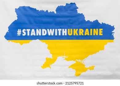 RIGA, LATVIA. 17th February 2022. Selective focus photo. Stand With Ukraine slogan, during Ukraine Week event near Monument of Freedom in Riga.