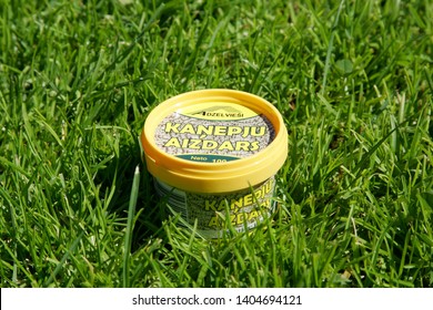 Riga, Latvia - 2009.07.23: Cannabis butter in yellow plastic container, old latvian recipes