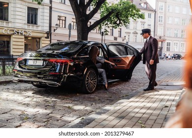 Riga, Latvia 21 July 2021 Limousine transfer chauffeur with chauffeur hat, stands by luxury car and open door for client.
Mercedes Benz S500 AMG S class w223 brand new model