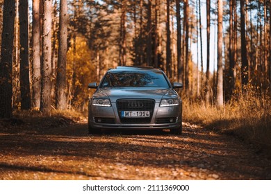 Riga, Latvia 21 October 2021: Front view of Audi A6 3.0 TDI Quattro on a forest road during a sunny autumn day