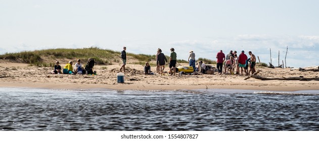 Riga, Latvia - 26.08.2017 Group Of People At River Coast