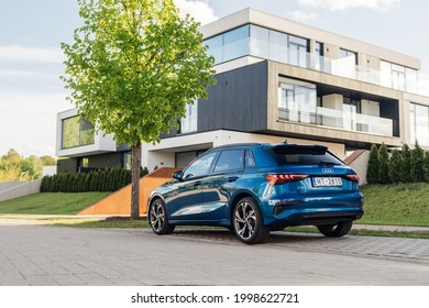 Riga, Latvia 28 June 2021 Audi A3 Sportback Fourth generation (8Y) Stands on parking lot by modern private house summer time mood. Rear and side view. 