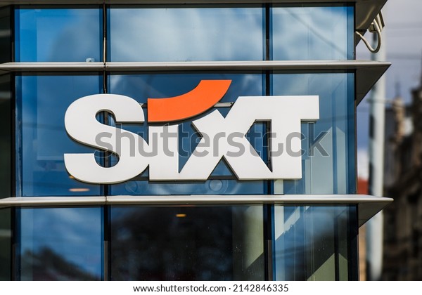RIGA, LATVIA. 31st March\
2022. Selective focus photo. Sixt company logo. Sixt is an\
international mobility service provider with about 2000 locations\
in over 110 countries.