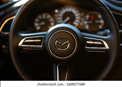 Riga, Latvia 7 January 2020 The Mazda CX-30 is a compact crossover SUV produced by Mazda. Close up view Mazda Steering wheel, background Mazda interior with steering wheel and dashboard.