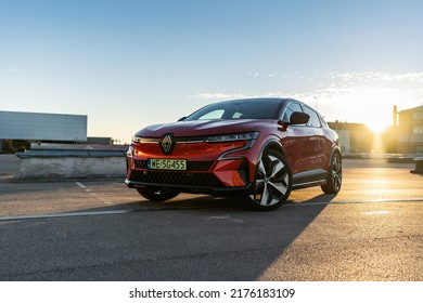 Riga, Latvia 8 July 2022, Renault Megane E-Tech Electric Is A Battery Electric-powered Small Family Car Set To Be Produced By The French Car Manufacturer. Stands On Parking Lot At Sunset Light Mood.