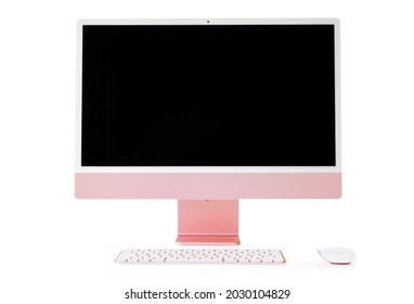Riga, Latvia - August 22, 2021: Apple's latest iMac desktop computer with blank screen in pink color.