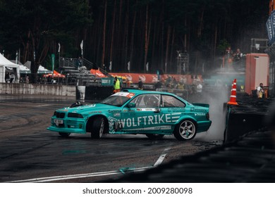 Riga, LATVIA, Bikernieki Raceway - JUN 12, 2021: FIA IDC Intercontinental drifting cup Nik Nak Nikolas Bertans drift on the BMW M3 E36 HKG at the wet track
