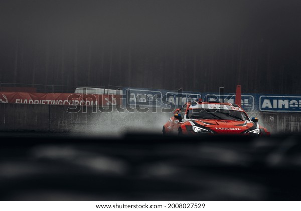 Riga, LATVIA, Bikernieki\
Raceway - JUN 12, 2021: FIA IDC Intercontinental drifting cup Alex\
Golovnya going fast in drift at the Toyota GT86 Lukoil with a lot\
of smoke