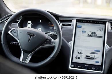 RIGA, LATVIA - DECEMBER 1, 2015: The Interior Of A Tesla Model S Electric Car With Its Large Touchscreen Dashboard.