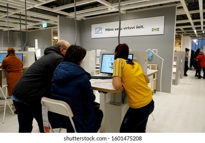 RIGA, Latvia - December 27, 2019: An IKEA Designer Works With Clients, Riga, Latvia. IKEA Is The World's Largest Furniture Retailer And Sells Ready To Assemble Furniture. 