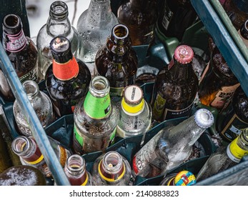 Riga, Latvia - February 20th 2022.: Different, Used, Beer Glass Bottles Prepared For Waste Recycling.