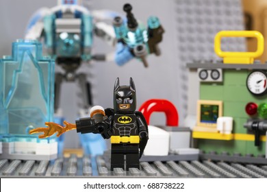 Riga, Latvia - July 29, 2017 Lego Batman With A Flame Thrower Minifigure Saves The Worker From Ice . Studio Shot.