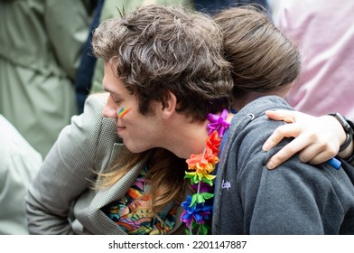 Riga, Latvia, June 18, 2022: Young People Gathering At Pride Festival In The City. Man With Hawaii Flower Wreath