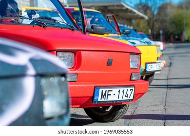 Riga, Latvia - May 01, 2021: line of colorful stylish vintage Fiat 126 PanCars rental cars, PanCars is a stylish compact car rental for team building , fun races and individual events