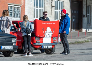 Riga, Latvia - May 01, 2021: line of colorful stylish vintage Fiat 126 PanCars rental cars, PanCars is a stylish compact car rental for team building , fun races and individual events