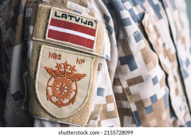 Riga, Latvia - May 13 2022: Latvian National Armed Forces With Flag Of Latvia And Emblem Of Support Command On A Soldier Uniform, NATO Force Integration Unit, Latvia To Reinstate Military Service