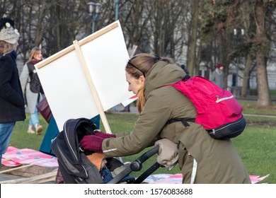 Riga, Latvia - November 30, 2019 : Back View Of Young Mother And Her Baby Child At Animal Advocacy Event Protest With Signs And Banners In Hands