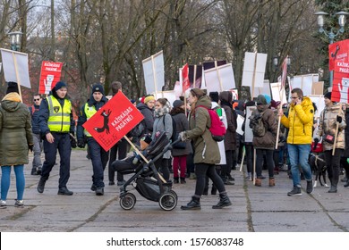 Riga, Latvia - November 30, 2019 : Young Mother With Her Child In Baby Buggy Surrounded By Animal Rights Activists At The March For Animal Advocacy In Riga, Latvia, Europe