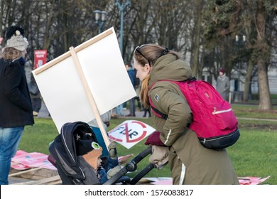 Riga, Latvia - November 30, 2019 : Young Mother With Her Child In Baby Buggy And NO FUR Sign Placard At The March For Animal Advocacy In Riga, Latvia, Europe