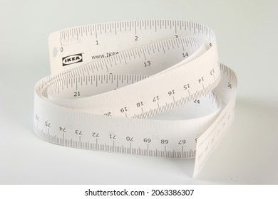 Riga, Latvia- October 25, 2021:  IKEA Tape Measure And Wooden Pencil On White Background