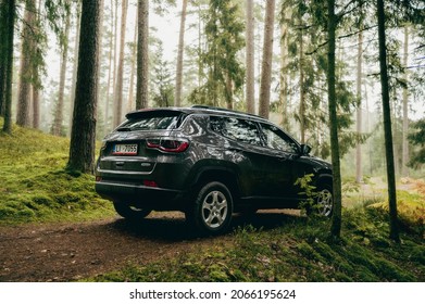 Riga, Latvia - September 12 2021: New Jeep Compass SUV in forest