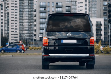Riga, LV - JUN 15, 2018: New Volkswagen Multivan 2018 Executive silhouette on parking of modern district 