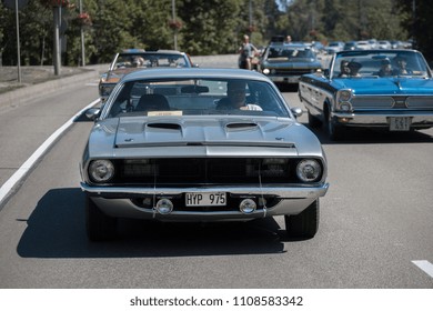 Riga, LV - JUN 3, 2018: 1971 Plymouth Hemi Cuda Rides On Street