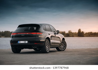 Riga, LV - MAY 14, 2019: Porsche Macan 2019 near river