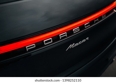 Riga, LV - MAY 14, 2019: Porsche Macan 2019 logo and led taillight