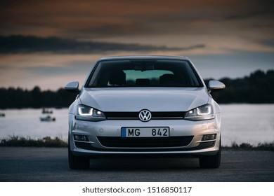 Riga, LV - SEP 17, 2019: Volkswagen Golf MK7 near river at the sunset