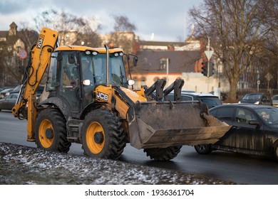 Riga, March 05, 2021: Industrial Tractor. Huge Yellow Tractor  Heavy Machine Service Car. Blurred Background